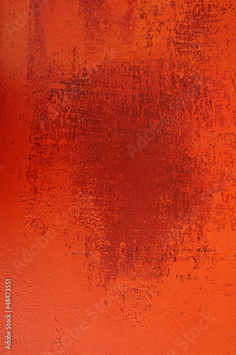 Stained rusty wall in hues of orange