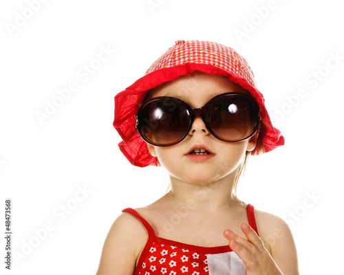 kid in the red hat and sunglasses