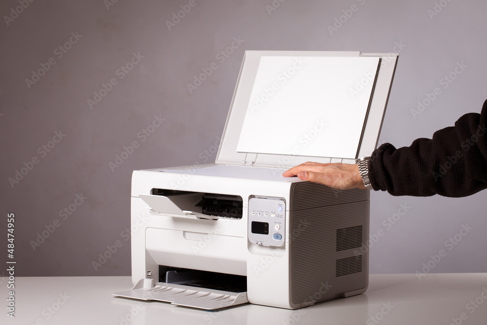 Man's hand with working copier Man's hand with working copier