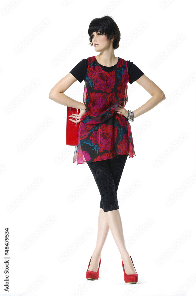 fashion girl holding little purse posing in the studio fashion girl holding little purse posing in the studio