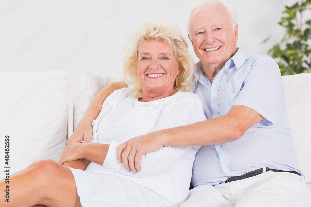 Joyful old couple portrait hugging