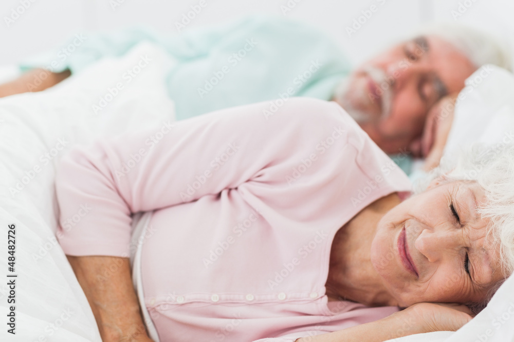 Couple sleeping in bed