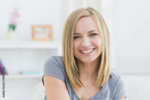Close-up of beautiful woman smiling at home