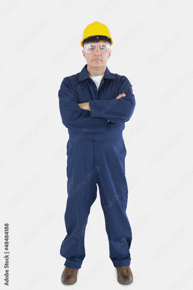 Confident technician wearing hardhat and eyewear