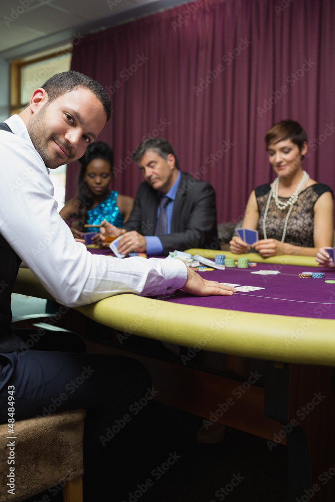 Smiling dealer at poker game Smiling dealer at poker game