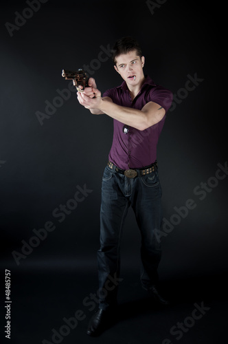attractive man with a gun