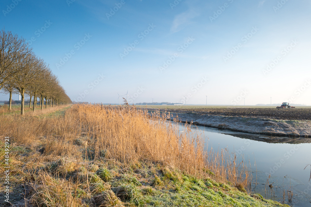Canal through the countryside in winter Canal through the countryside in winter