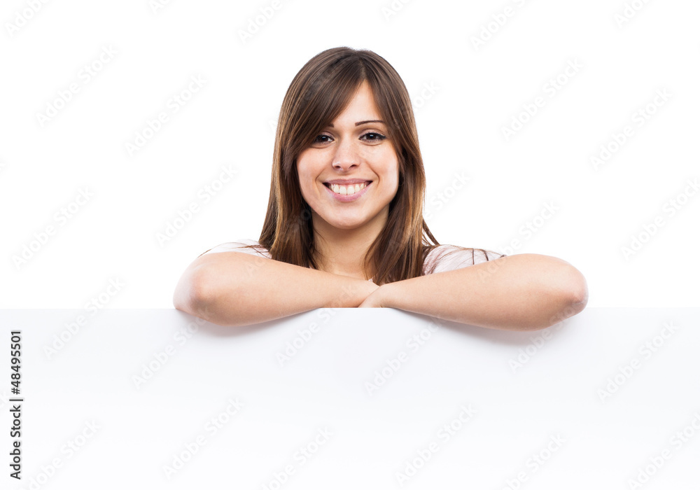 Portrait of a young woman with blank billboard Portrait of a young woman with blank billboard
