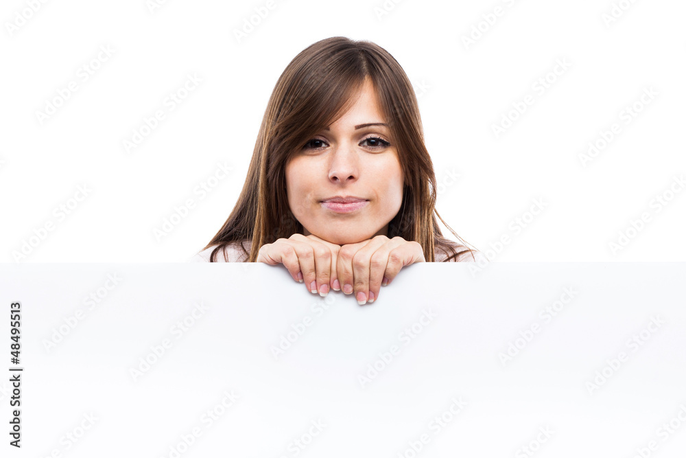 Portrait of a young woman with blank billboard Portrait of a young woman with blank billboard