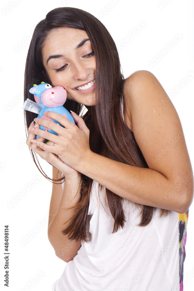beautiful young woman smiling with a cow piggy bank beautiful young woman smiling with a cow piggy bank