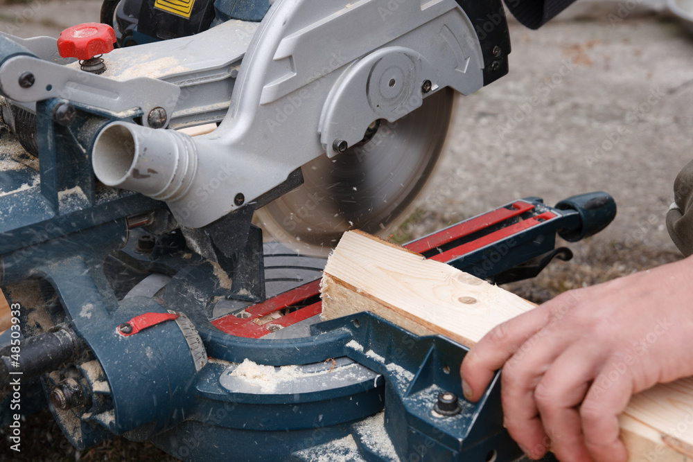 Carpenter sawing plank Carpenter sawing plank