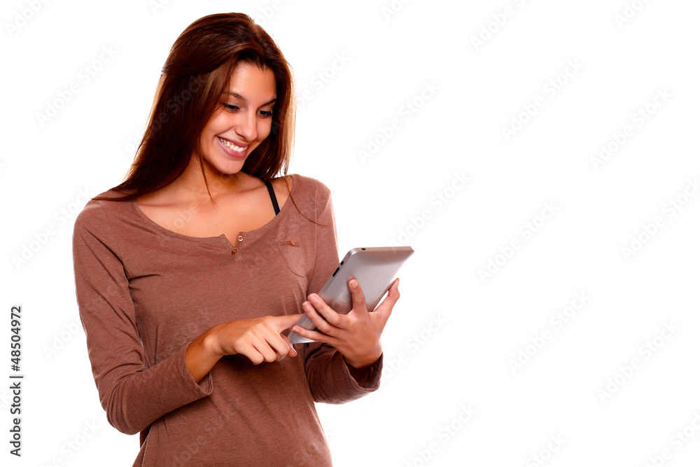Smiling young female reading on tablet pc screen Smiling young female reading on tablet pc screen