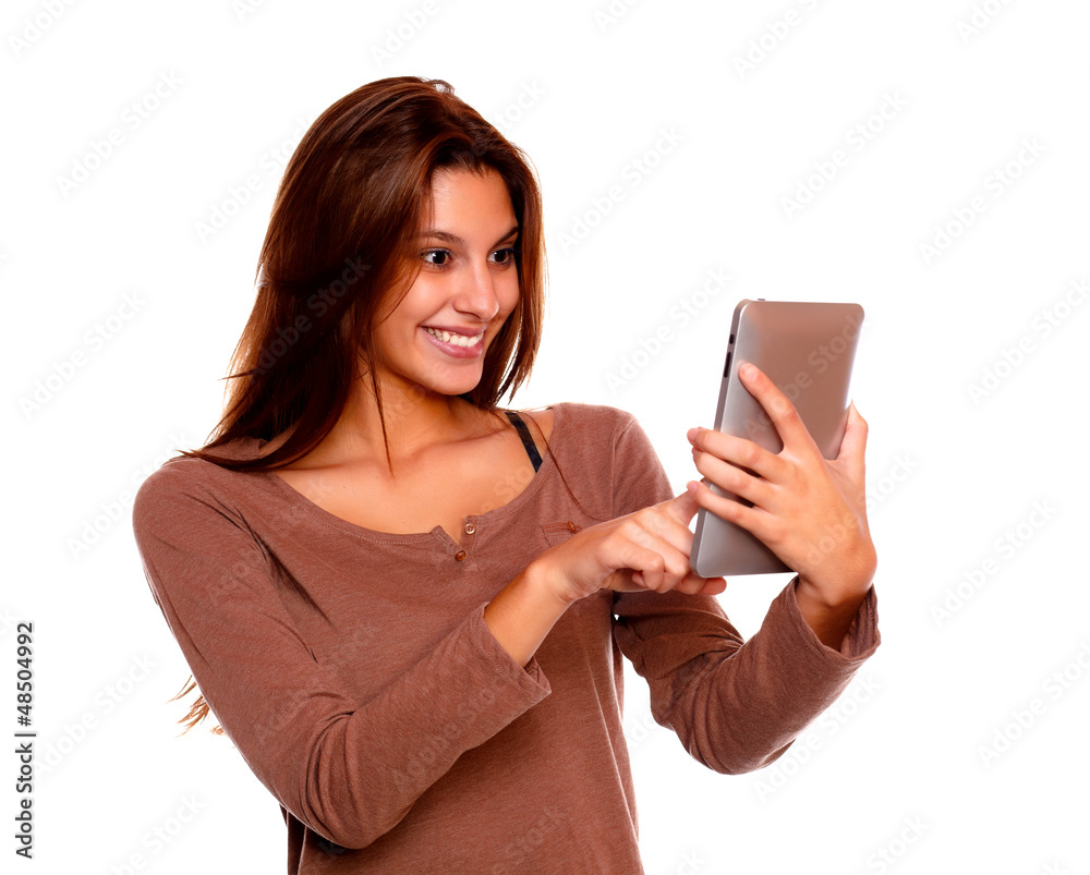 Charming young female reading on tablet pc screen Charming young female reading on tablet pc screen