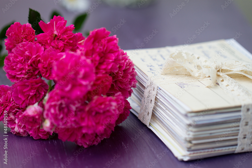 stack of old letters with roses stack of old letters with roses