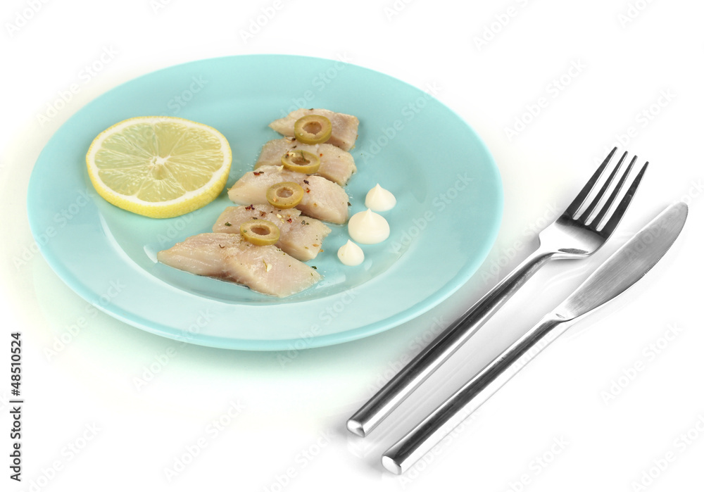 Dish of herring and lemon on plate isolated on white