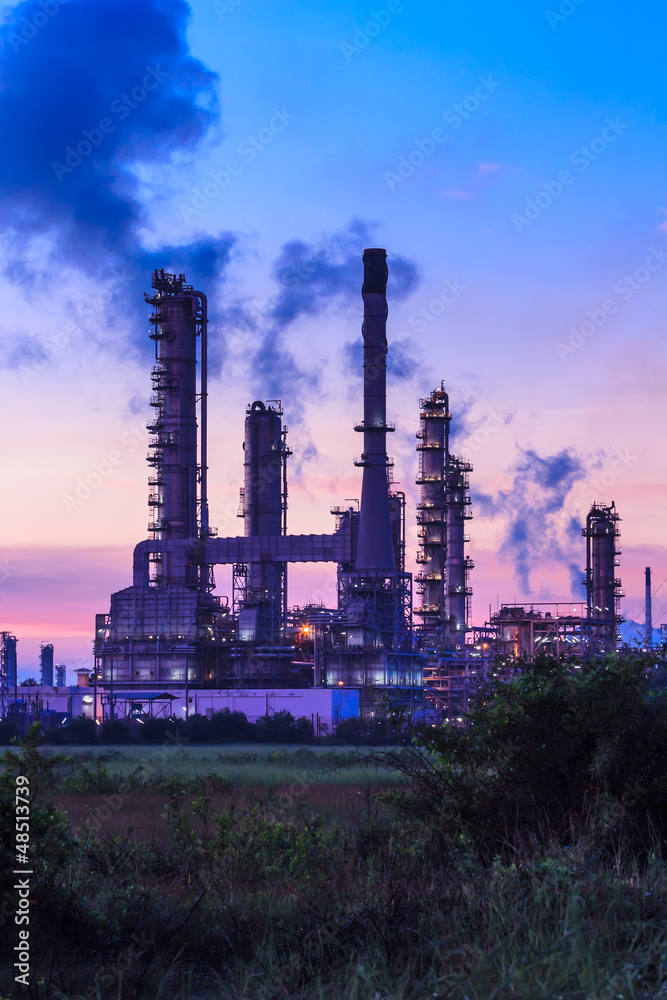 oil refinery plant and smoke at twilight morning