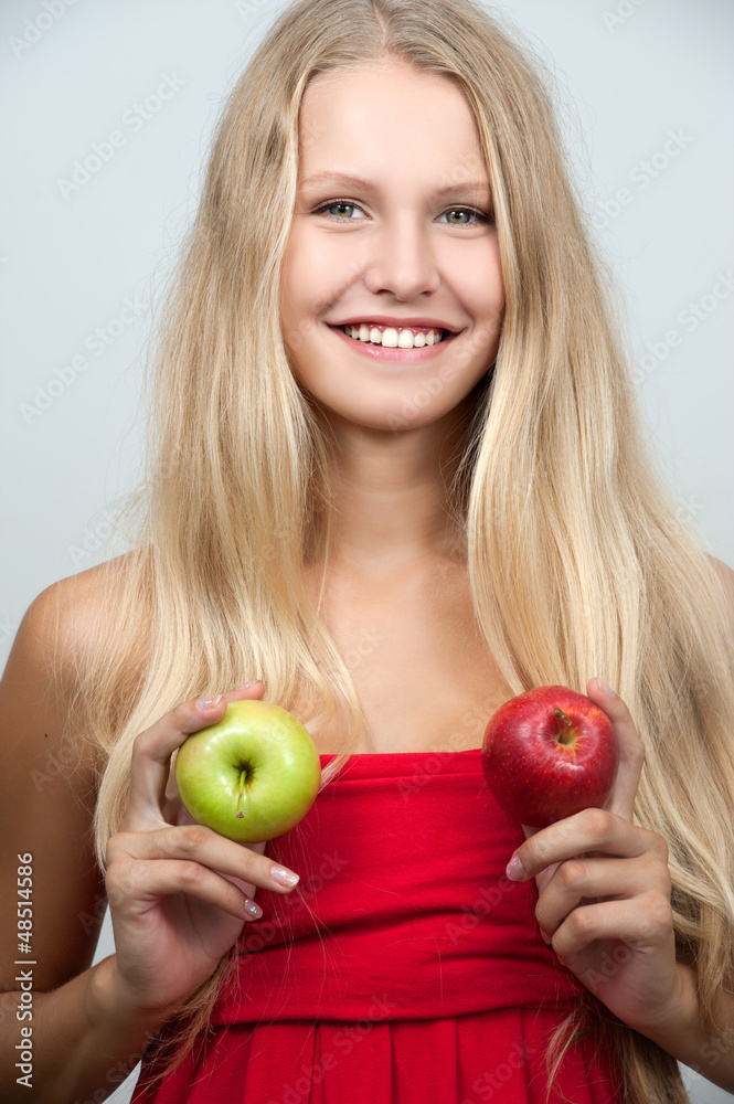 Bright spring portrait of happy healthy woman holding apple Bright spring portrait of happy healthy woman holding apple