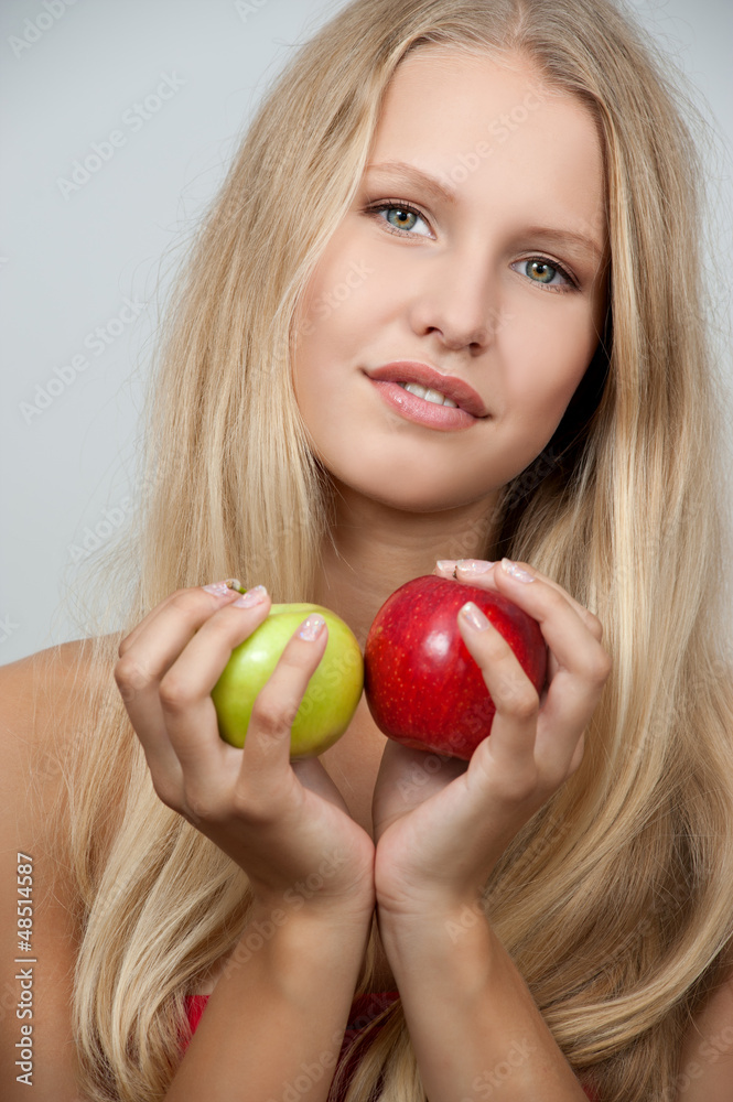 Bright spring portrait of happy healthy woman holding apple Bright spring portrait of happy healthy woman holding apple