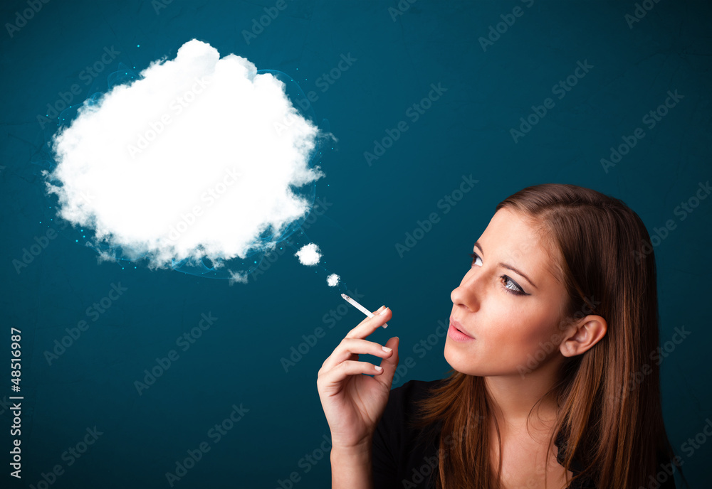 Obraz premium Young woman smoking unhealthy cigarette with dense smoke