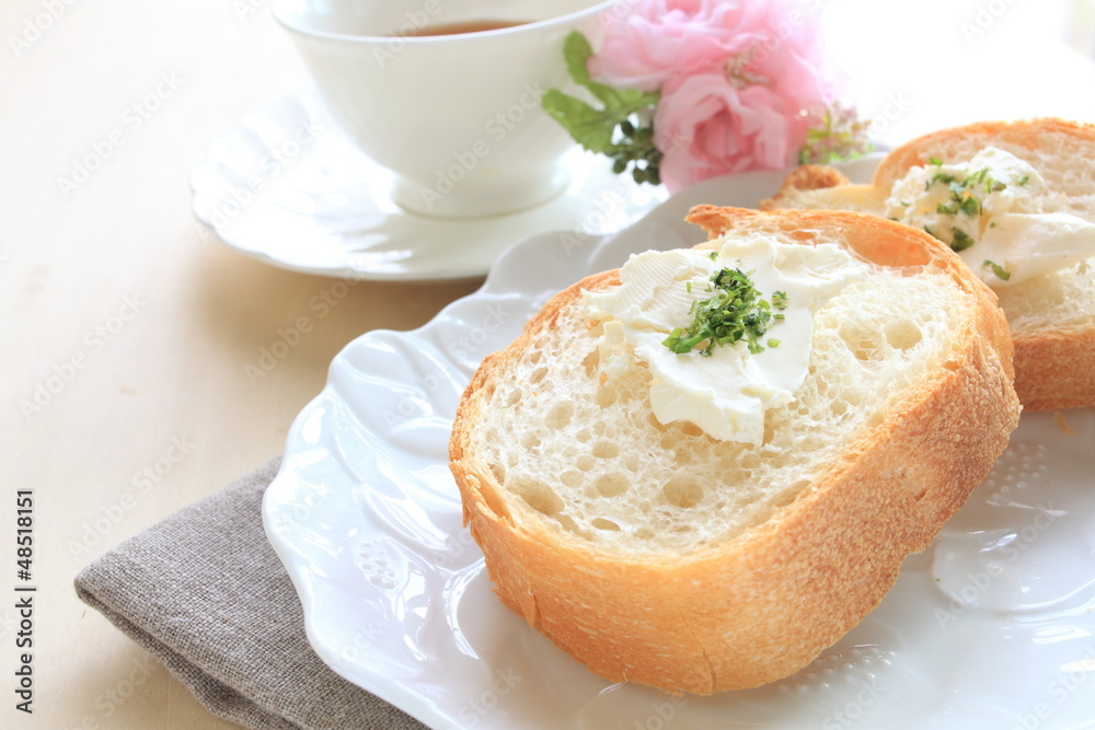 french bread, baguette slided with butter and herb french bread, baguette slided with butter and herb