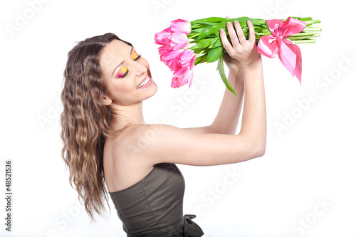 young woman with bouquet of flowers over white background photo