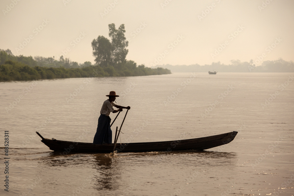 Myanmar man rowed across the river.