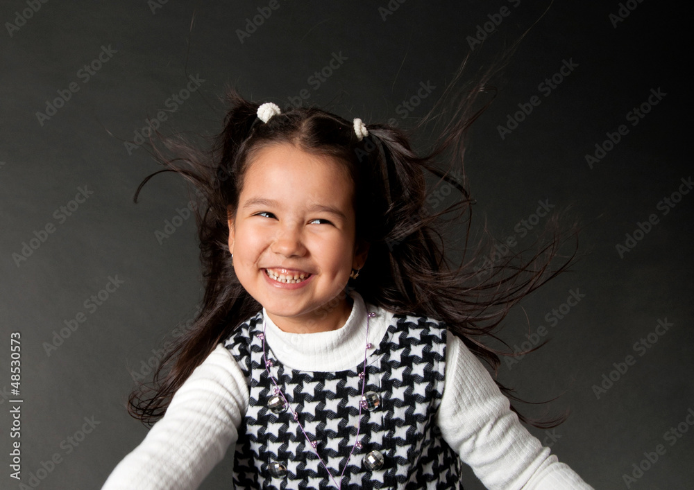 charming girl with flying hair and dimples on her cheeks charming girl with flying hair and dimples on her cheeks