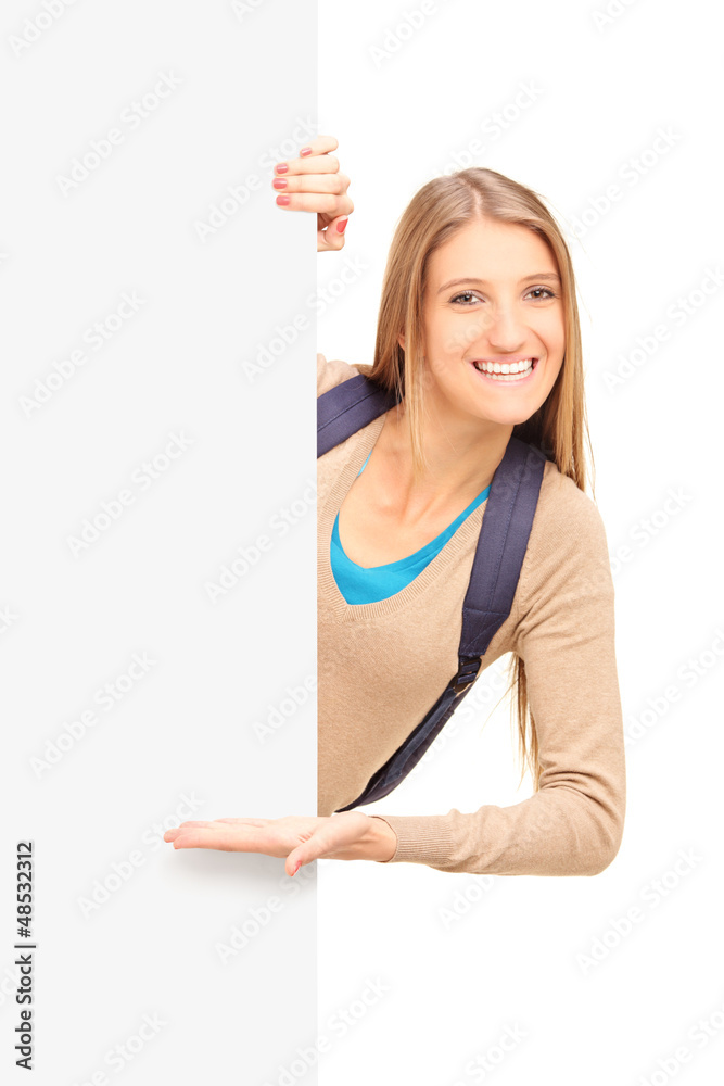 A smiling female student gesturing on a panel A smiling female student gesturing on a panel