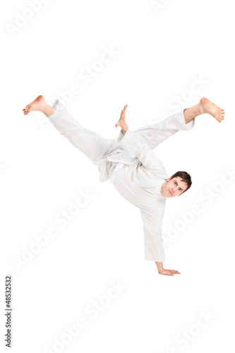 A young karate man performing