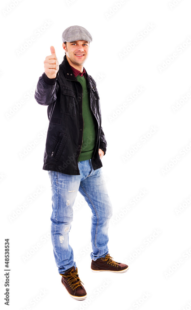 Happy young man smiling and showing thumb up Happy young man smiling and showing thumb up
