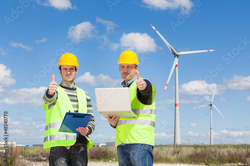 Technician Engineers Thumbs Up with Wind Power Generator