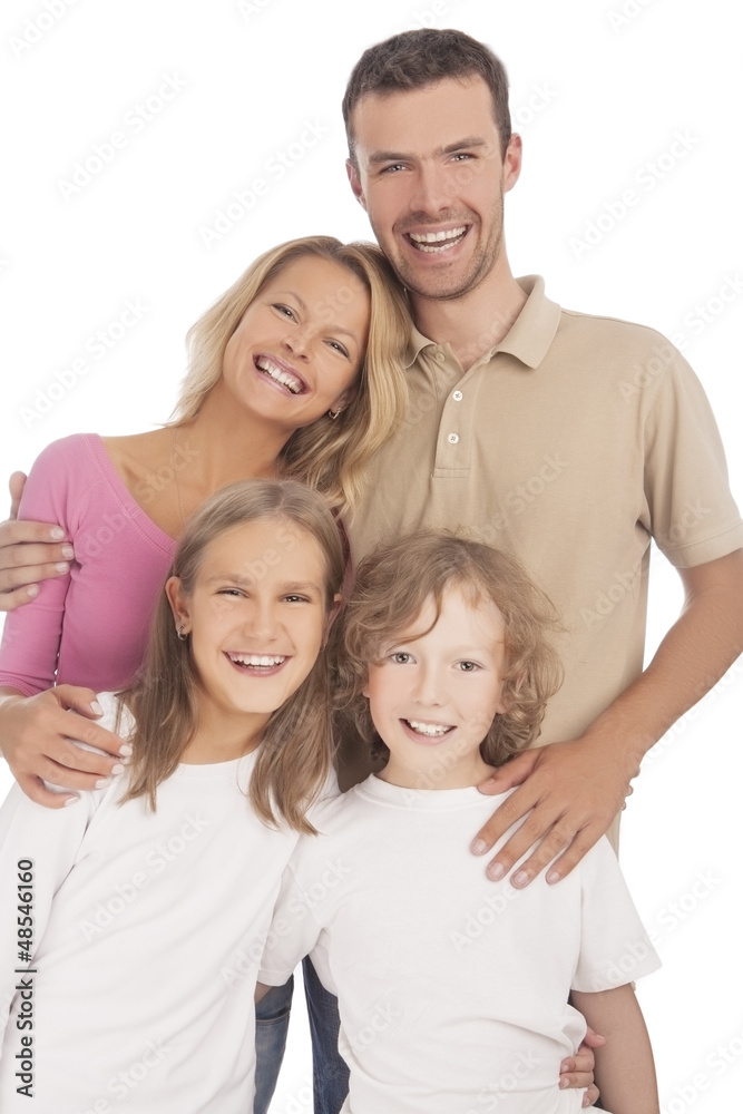 four happy caucasian family members standing together and smilin