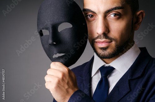 Man with black mask in studio photo