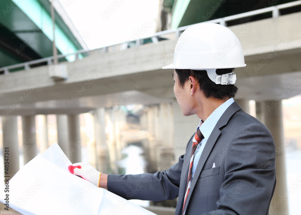 architect with blueprint highway construction site architect with blueprint highway construction site