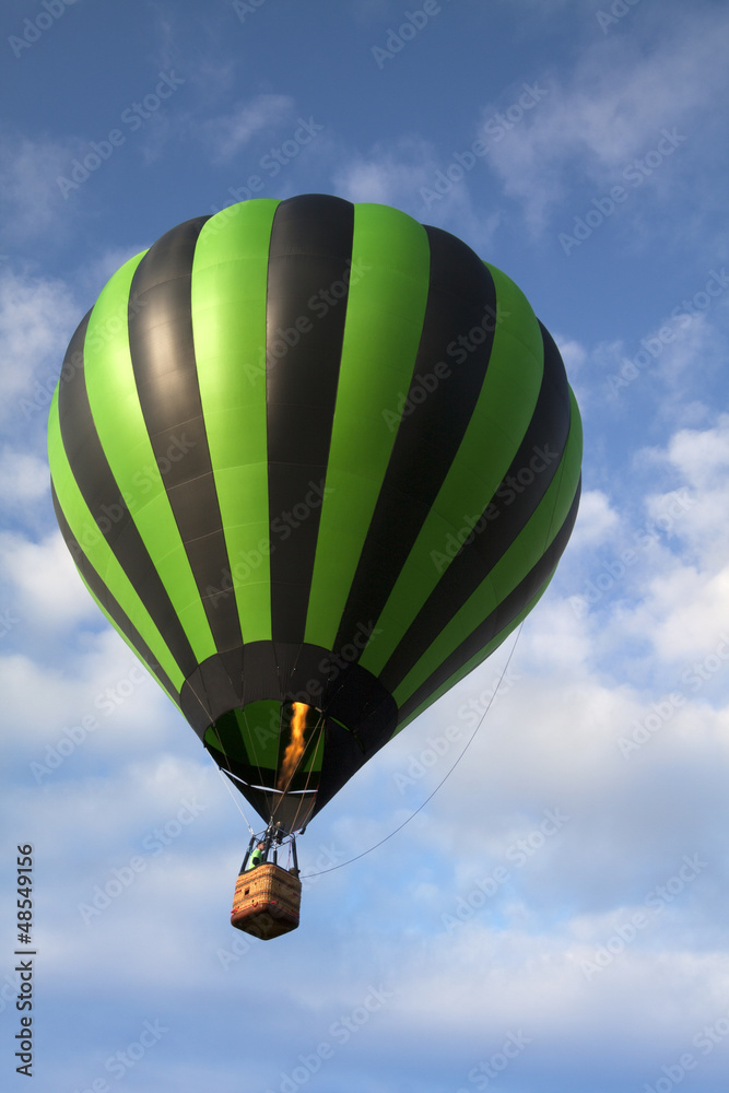 Hot air balloon rising in the sky Hot air balloon rising in the sky