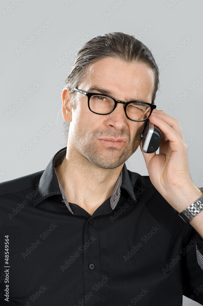 man is skeptical on the phone man is skeptical on the phone