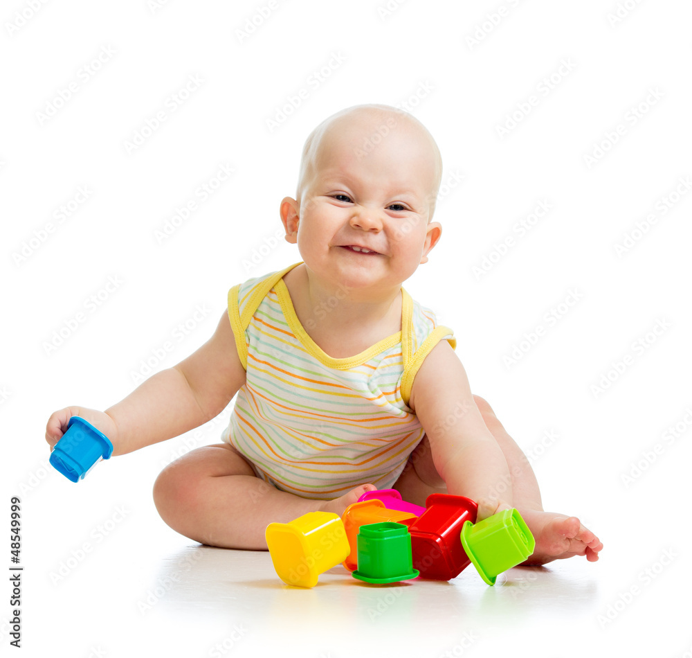 Funny little child is playing with toys isolated over white Funny little child is playing with toys isolated over white