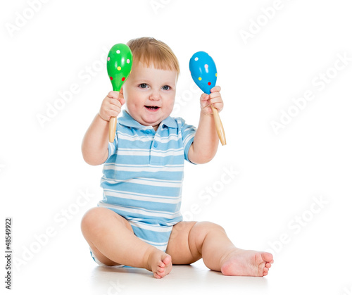 Baby  boy playing with musi...