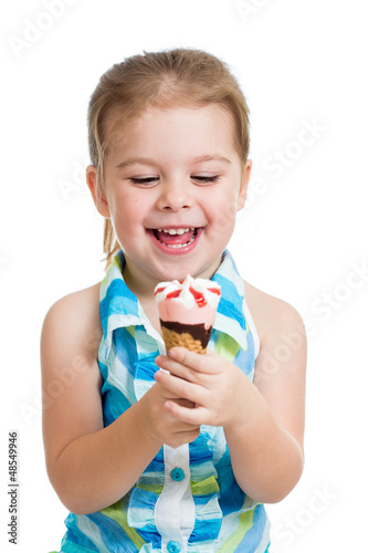 joyful child girl eating ic...