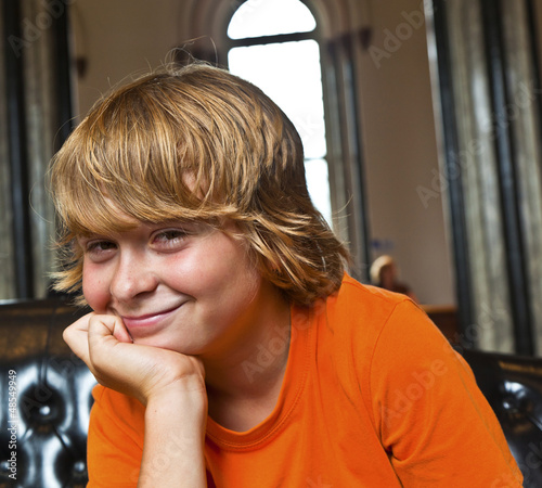 boy takes a rest at a sofa photo