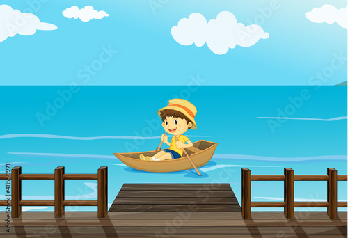 A boy riding a boat