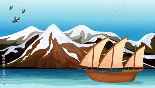 A boat floating near the mountain area