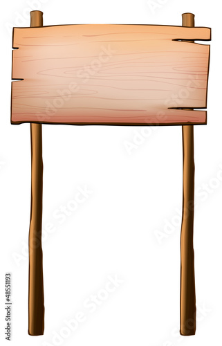 An empty wood signboard with two posts