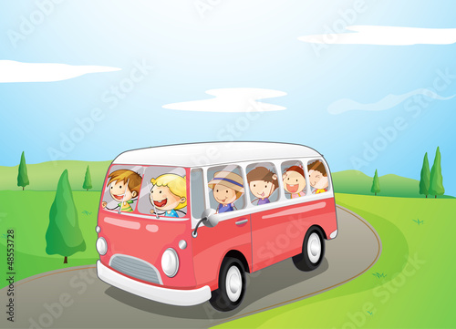 Little children riding in a bus