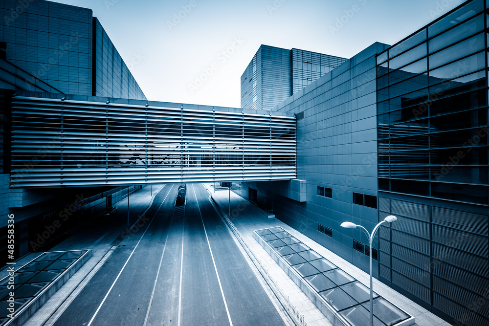 Fototapeta premium road go through the modern office building