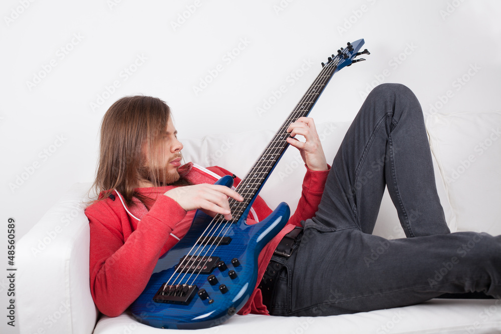 Fototapeta premium young guy playing guitar