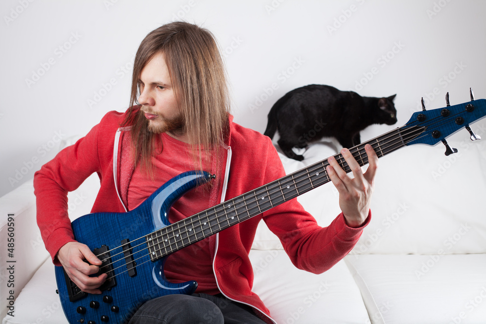 Fototapeta premium young guy playing guitar