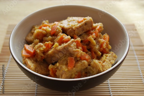 Stew tempeh with carrots and onion