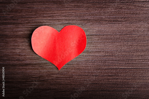 Valentine's Day background. red heart on a wooden background