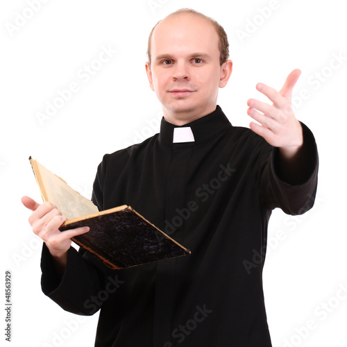 Photos Young pastor with Bible, isolated on white